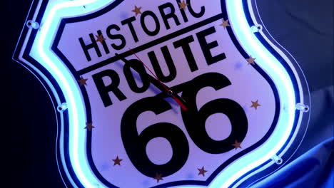 Clock-hands-spin-on-a-neon-Historic-Route-66""-clock-face""