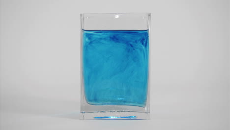 Blue-dye-diffuses-through-a-glass-of-water