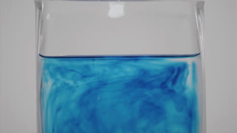 Blue-dye-diffuses-through-a-glass-of-water-1