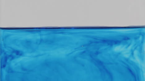 Blue-dye-diffuses-through-a-glass-of-water-2