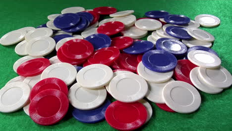 A-pile-of-poker-chips-on-a-green-felt-table