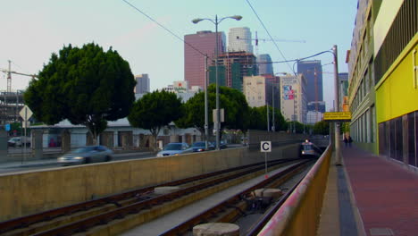 The-LA-Metro-train-emerges-with-the-city-skyline-background-1