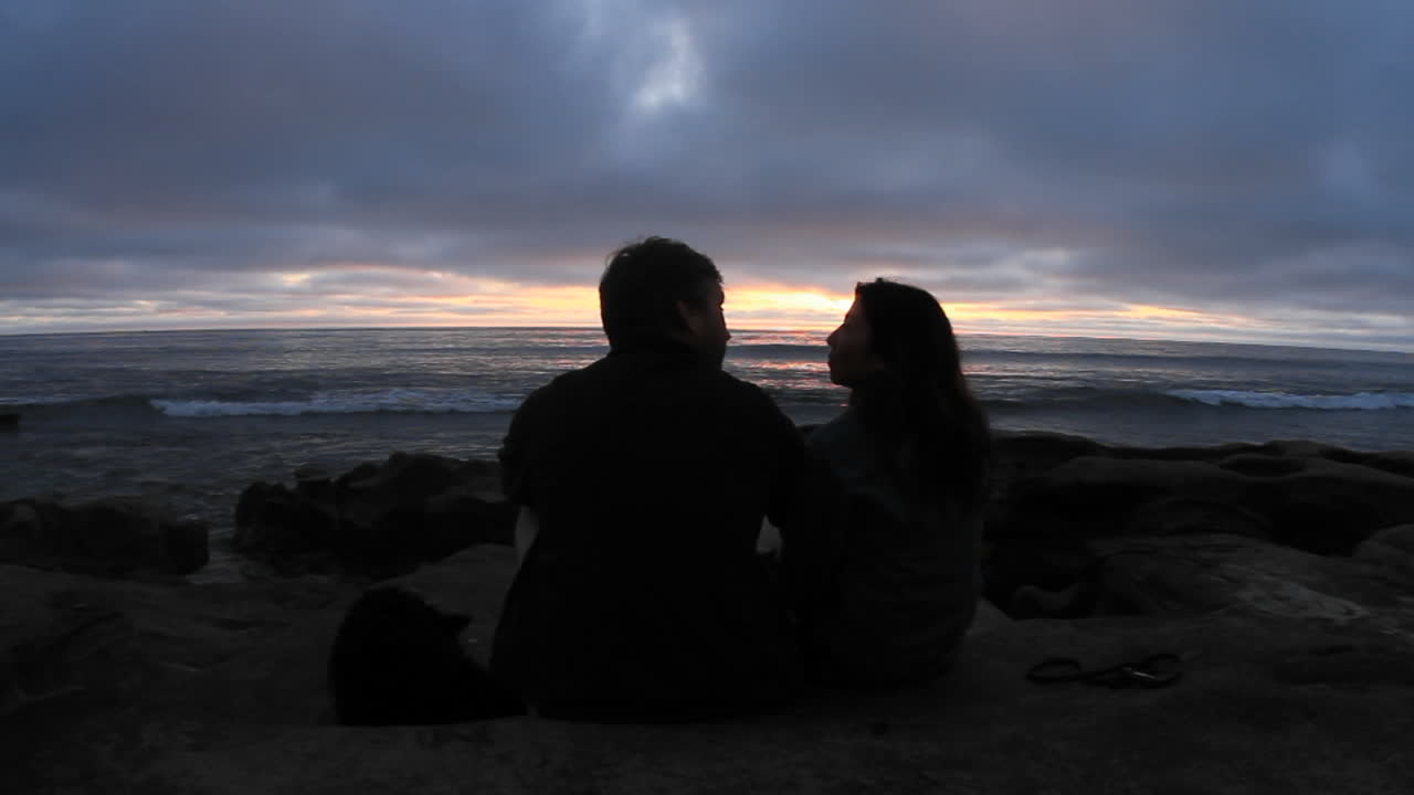 A Couple Kiss On A Beach Just After Sunset Free Stock Video Footage  Download Clips