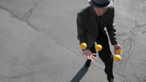 A-man-does-a-juggling-act-in-the-street