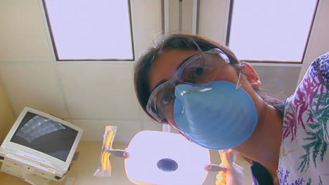 A-dental-hygienist-finishes-cleaning-a-patient's-teeth-from-a-POV-of-the-patient