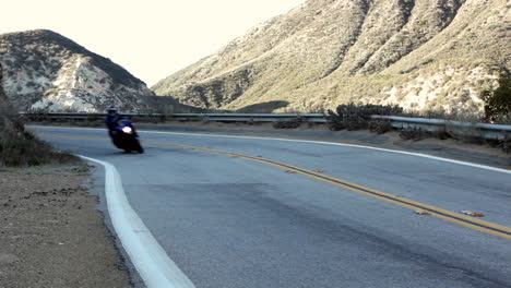 Motorcycle-and-cars-on-winding-mountain-road-2