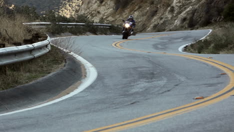 Motorcycle-and-cars-on-winding-mountain-road-5