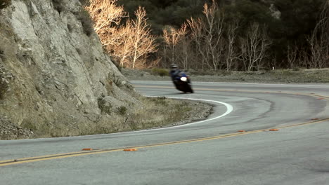 Motorcycle-and-cars-on-winding-mountain-road-6