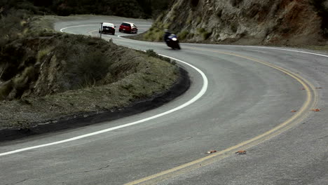 Motorcycle-and-cars-on-winding-mountain-road-7