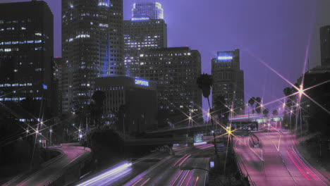 Excellent-shot-of-heavy-traffic-driving-on-a-busy-freeway-in-downtown-Los-Angeles-at-night-1