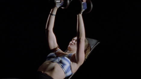 A-woman-exercises-with-dumbbells-1