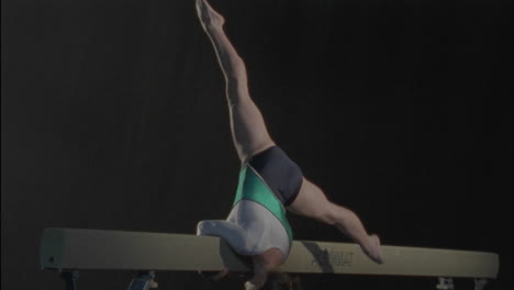 A-female-gymnast-performs-a-routine-on-the-bar