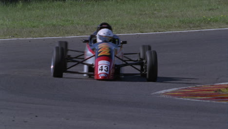 Formula-cars-race-on-a-circuit-track-2