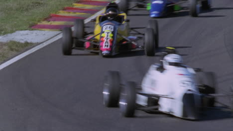 Formula-cars-racing-on-a-circuit-track