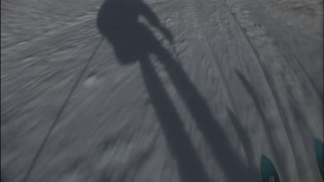 A-skier's-shadow-precedes-him-down-the-hill