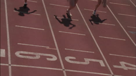 Three-women-run-on-a-running-track