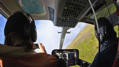 Passenger-and-pilot-in-a-helicopter-flying-over-the-tundra-at-Cerroes-Yanteles-in-Parque-Nacional-Corcovado