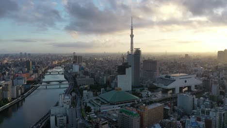 Aerial-of-the-Tokyo-Skytree-is-seen-at-sunset-nestled-in-the-skyline-of-Tokyo-Japan