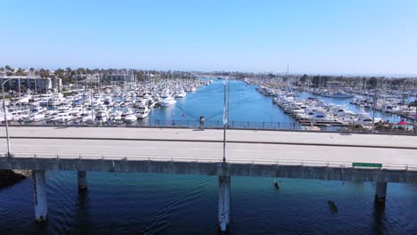 Rising-Aerial-Of-Oxnard-Harbor-With-Boats-Yachts-And-Marina-California