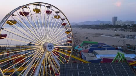 Aerial-Of-The-Santa-Monica-Pier-And-Ferris-Wheel-At-Night-Or-Dusk-Light-Los-Angeles-California
