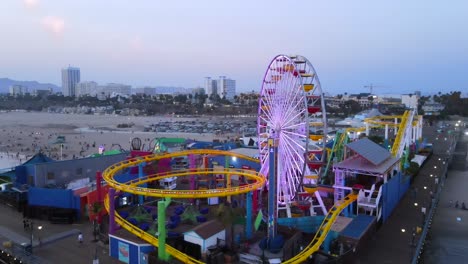Aerial-Of-The-Santa-Monica-Pier-And-Ferris-Wheel-At-Night-Or-Dusk-Light-Los-Angeles-California-1