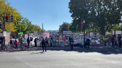 Cars-Drive-Past-Black-Lives-Matter-Protestors-And-Their-Signs-In-Washington-Dc