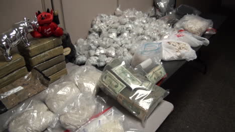 Weapons-And-Drugs-Are-Seized-By-The-Dea-During-A-Drug-Raid