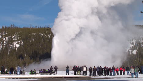 Old-Faithful-Erupts-In-Winter-In-Yellowstone-National-Park