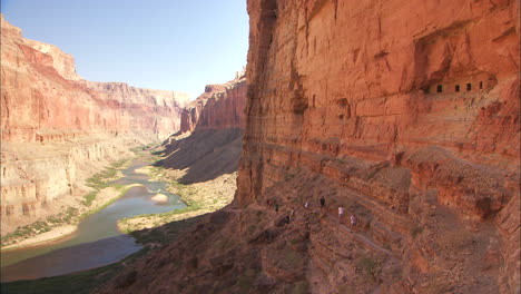 Hikers-On-A-Narrow-Trail-Along-A-Cliff-In-The-Grand-Canyon
