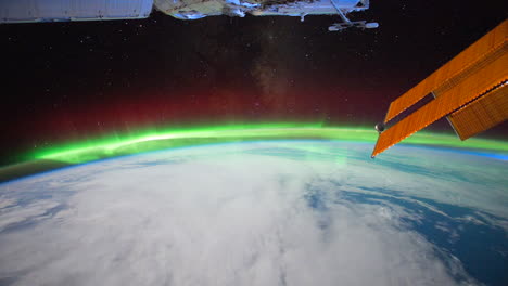 The-International-Space-Station-Flies-Over-The-Earth-With-Aurora-Borealis-Visible