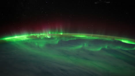 The-International-Space-Station-Flies-Over-The-Earth-With-Aurora-Borealis-Visible-1