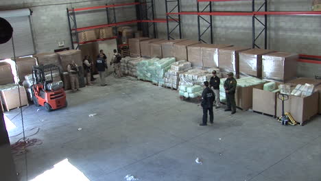 Dea-Agents-Guard-Confiscated-Drugs-In-A-Warehouse