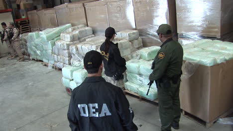 Dea-Agents-Guard-Confiscated-Drugs-In-A-Warehouse-1