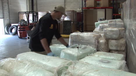 Dea-Agents-Stack-Confiscated-Drugs-In-A-Warehouse