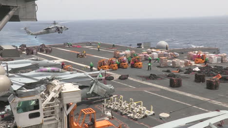 The-Deck-Of-A-Us-Aircraft-Carrier-Is-Prepared-For-A-Humanitarian-Airlift-1