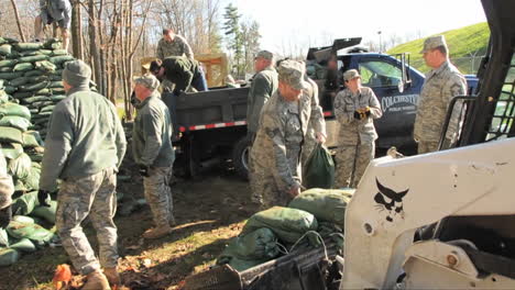 Army-Volunteers-Work-To-Sandbag-A-Flooded-Area-During-A-Storm