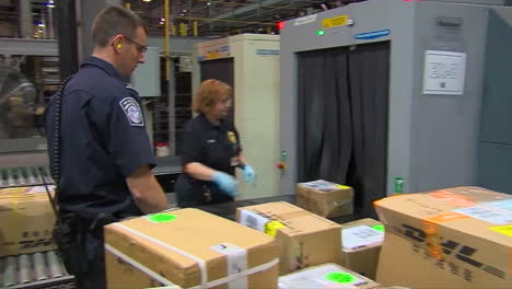 Homeland-Security-Agents-Search-A-Suspicious-Package-In-A-Shipping-Facility