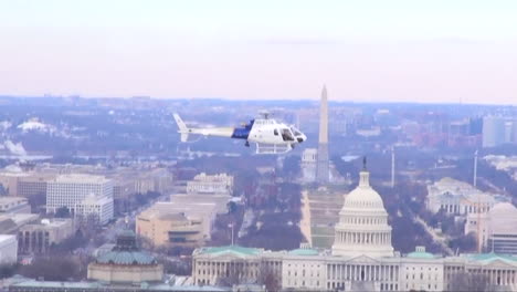 Us-Customs-And-Border-Protection-Helicopter-Flies-Against-The-Us-Capital-Skyline