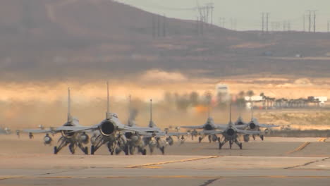 F15-And-F16-Fighter-Jets-Line-Up-And-Taxi-For-Takeoff-In-A-Military-Exercise-3