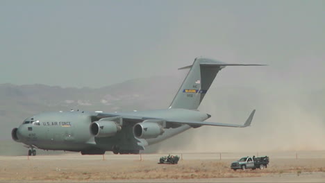 A-C130-Cargo-Plane-Taxis-On-A-Dirt-Runway-In-The-Desert