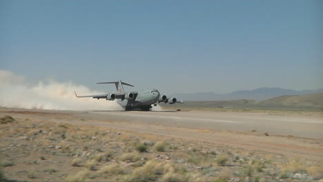A-C130-Cargo-Plane-Takes-Off-From-A-Dirt-Runway-In-The-Desert-1