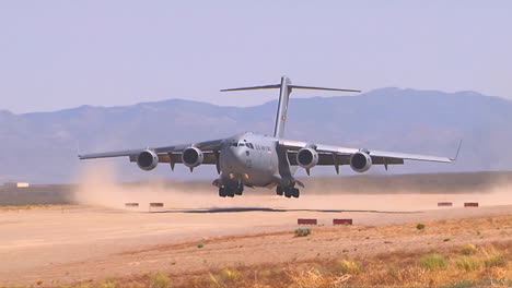 A-C130-Cargo-Plane-Lands-On-A-Dirt-Runway-In-The-Desert-2