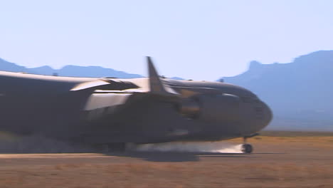 A-C130-Cargo-Plane-Lands-On-A-Dirt-Runway-In-The-Desert-4
