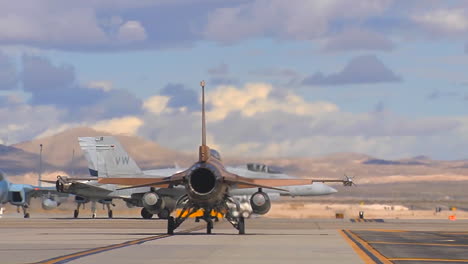 F15-And-F16-Fighter-Jets-Line-Up-And-Taxi-For-Takeoff-In-A-Military-Exercise-6