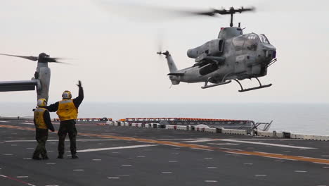 An-Ah1W-Super-Cobra-Helicopter-Lands-And-Takes-Off-From-The-Deck-Of-An-Aircraft-Carrier