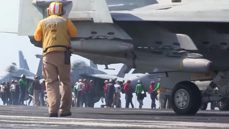 Various-Jet-Aircraft-Taxi-And-Maneuver-On-The-Deck-Of-An-Aircraft-Carrier