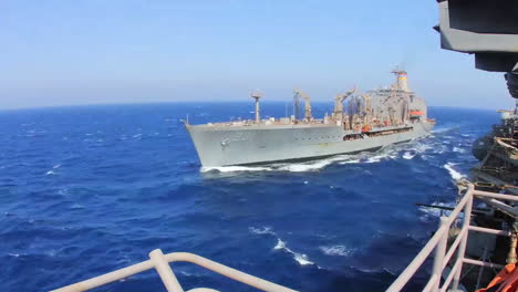 Time-Lapse-Shot-From-The-Deck-Of-An-Aircraft-Carrier-Of-A-Supply-Ship-Beside