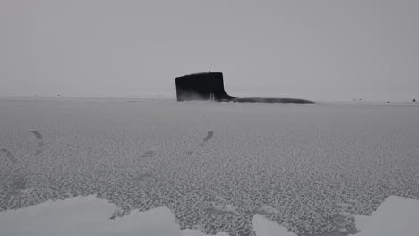 A-Submarine-Surfaces-Through-Sea-Ice-In-The-Arctic