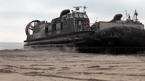 An-Amphibious-Assault-Vehicle-Inflates-And-Moves-Off-A-Beach