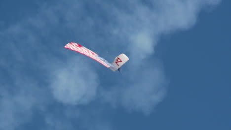 A-Parachutist-Descends-Flying-An-American-Flag